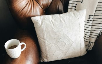 Wallpaper Square White Throw Pillow on Brown Leather Sofa Chair