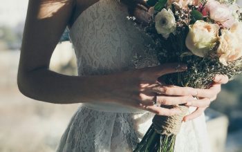 Wallpaper Woman in White Floral Strapless Dress Holding Flowers