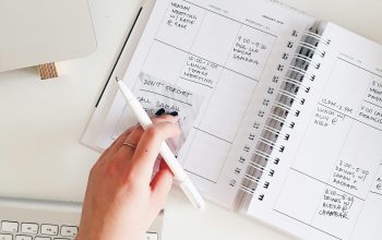 Wallpaper Person Holding Notepad and Pen Flat Lay