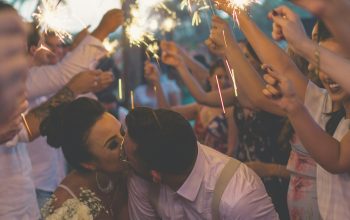 Wallpaper Newlywed Kiss Surrounded by People