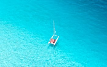Wallpaper Aerial View Photography of Sailboat on Body of Water