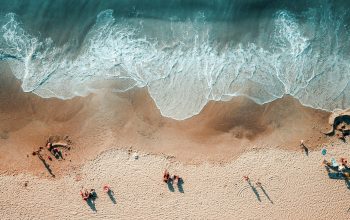 Wallpaper Aerial Photography of People Near Shoreline