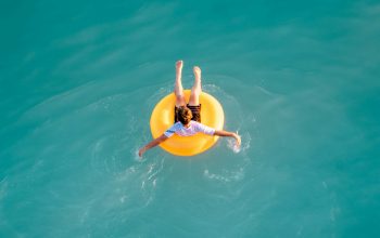 Wallpaper Boy Sitting on Buoy