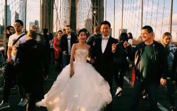 Wallpaper Couple Standing on Suspension Bridge