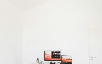 Wallpaper Turned On Flat Screen Monitor and Laptop on Desk