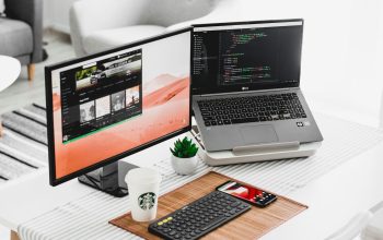 Wallpaper Black Flat Screen Computer Monitor and Laptop on Table