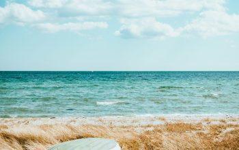 Wallpaper Boat on Beach Under Blue Sky