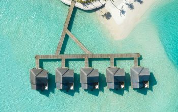 Wallpaper Brown Huts on Body of Water in Aerial Photography
