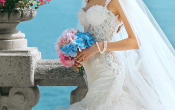 Wallpaper Woman in Wedding Dress Holding Flowers