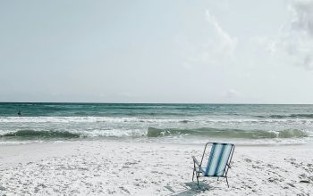 Wallpaper Black Armchair on Seashore