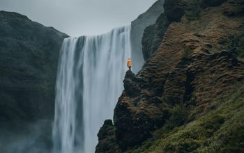 Wallpaper Person Standing Near Waterfalls