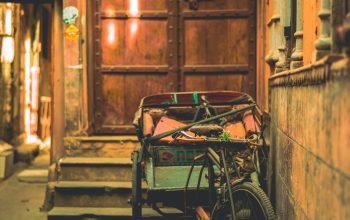 Wallpaper Gray Trike in Front of Closed Door
