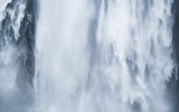 Wallpaper Person in Blue Jacket at Waterfall