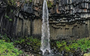 Wallpaper Water Falls Between Gray Rocks