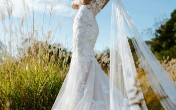 Wallpaper Woman in White Wedding Dress Standing on Green Grass Field During Daytime