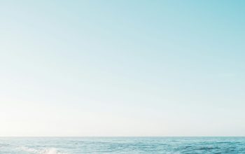 Wallpaper Ocean Waves Under Blue Sky