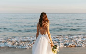 Wallpaper Woman in White Wedding Dress Standing on Beach During Daytime