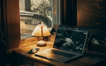 Wallpaper Macbook Pro on Brown Wooden Table