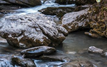 Wallpaper Gray and Black Rocks on River