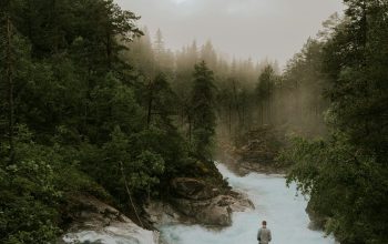 Wallpaper Person Standing on Rock Near River