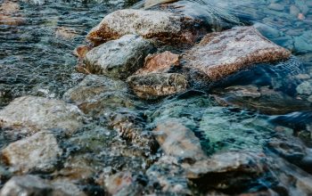Wallpaper Brown and Gray Rock on Water