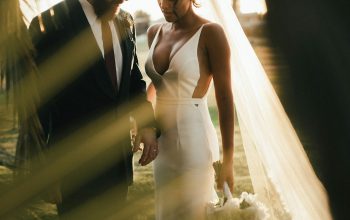Wallpaper Man in Black Suit Holding Woman in White Wedding Dress