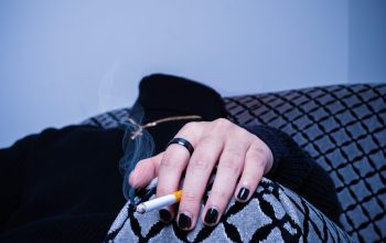 Wallpaper Person in Black and White Shirt Holding Orange and White Pen