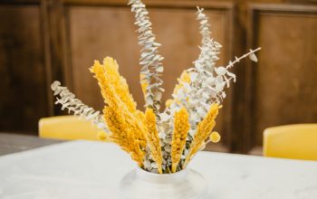 Wallpaper Yellow Flowers in White Ceramic Vase