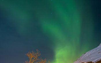 Wallpaper Snow Covered Mountain Under Green Sky
