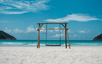 Wallpaper Brown Wooden Swing on White Sand Beach During Daytime