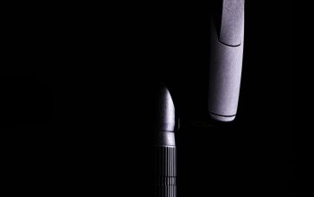 Wallpaper Black and Silver Microphone on White Background