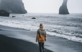 Wallpaper Woman in Yellow Jacket on Seashore