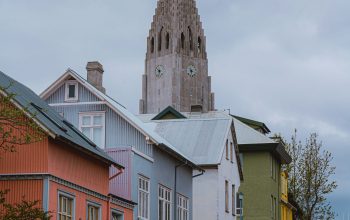 Wallpaper A Row of Houses with a Church Steeple