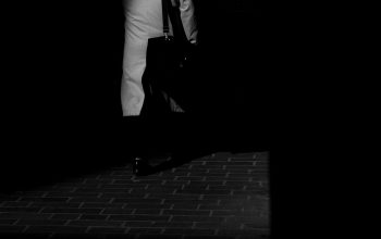 Wallpaper A Black and White Man in a Suit