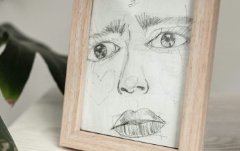 Wallpaper A Picture Frame with a Woman’s Face
