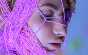 Wallpaper A Woman with Purple Hair and a Purple String