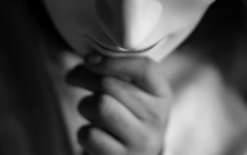 Wallpaper A Black and White Woman Hiding Her Face