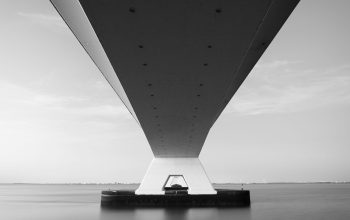 Wallpaper A Boat Under a Bridge