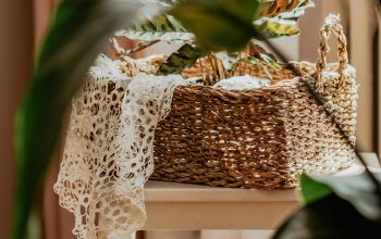 Wallpaper A Basket Sitting on a Stool Next to a Window