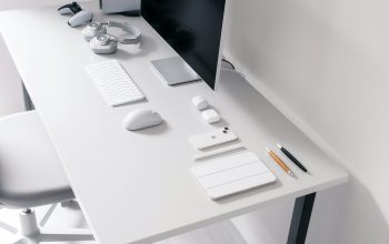 Wallpaper A Desk with a Computer and a Chair
