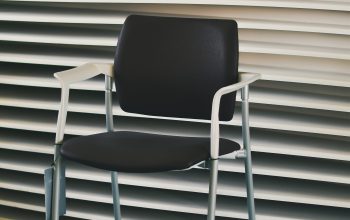Wallpaper A Chair in Front of a Wall