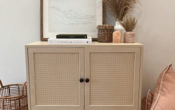 Wallpaper A White Cabinet with a Picture on Top