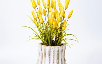 Wallpaper A White Vase with Yellow Flowers