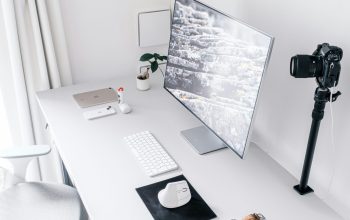 Wallpaper A Desk Setup: Monitor, Keyboard, Mouse, and Camera