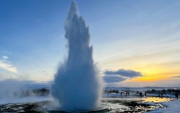 Wallpaper A Large Geyser Spewing Water into the Sky