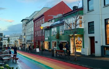 Wallpaper A Rainbow Painted Street in a Small Town
