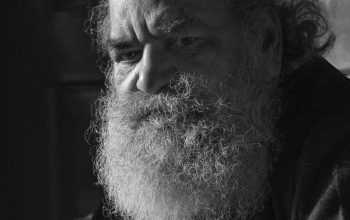 Wallpaper A Black and White Portrait of a Bearded Man
