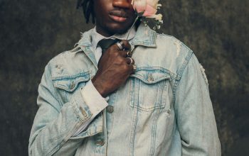 Wallpaper A Man with a Flower in His Mouth