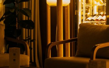 Wallpaper A Living Room with a Chair and a Lamp