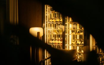 Wallpaper A Dimly Lit Room with a Wine Rack